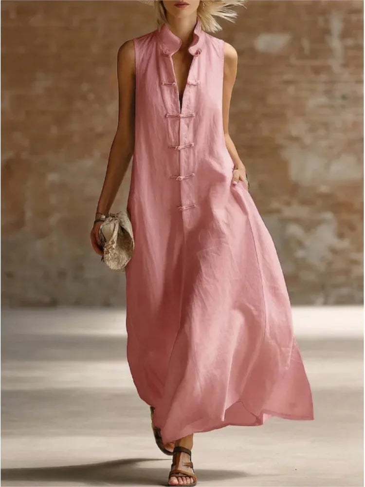 Elegant women's flowy sleeveless maxi shirt dress. Ideal for vacation wear, beach outings, or travel. Chic style.