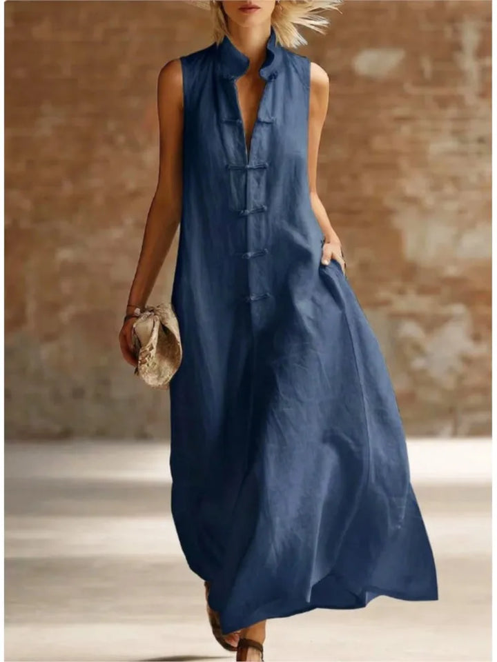 Women's sleeveless button-front maxi dress. An elegant yet casual shirt dress, perfect for summer and travel fashion.