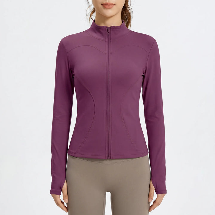 Versatile women's activewear jacket, slim-fit outer layer for dynamic workouts, running, and gym sessions.