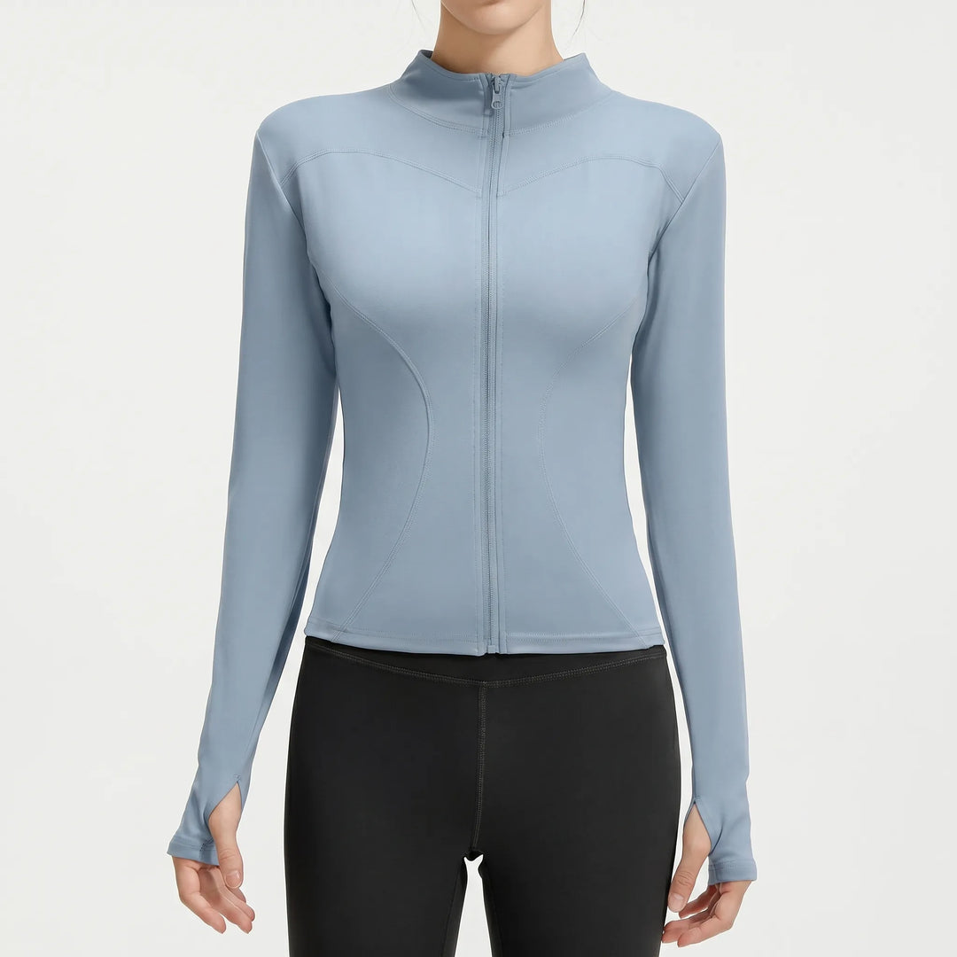 Women's slim-fit workout jacket. Athletic running top & gym wear. Long sleeve activewear outer layer.