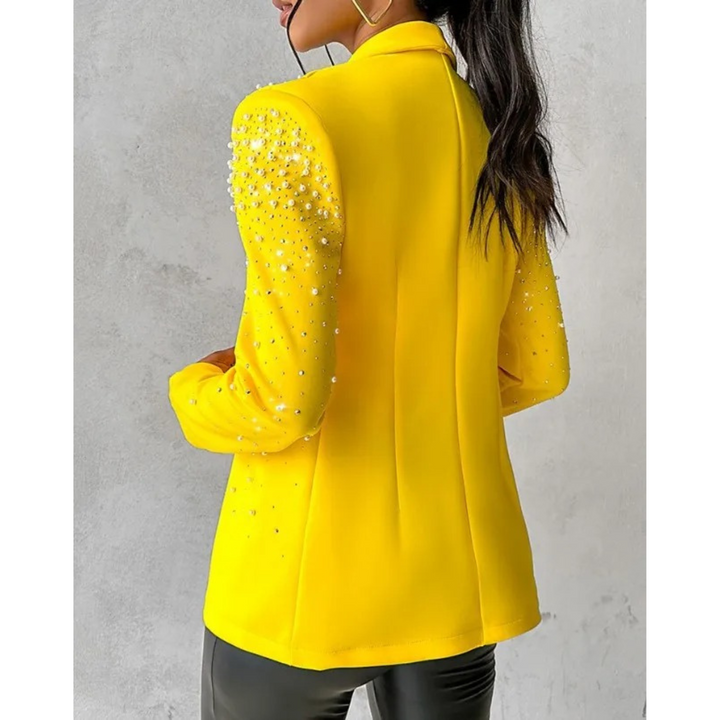 Tailored women's slim fit blazer, featuring elegant pearl details. Perfect long sleeve formal jacket for ladies fashion.