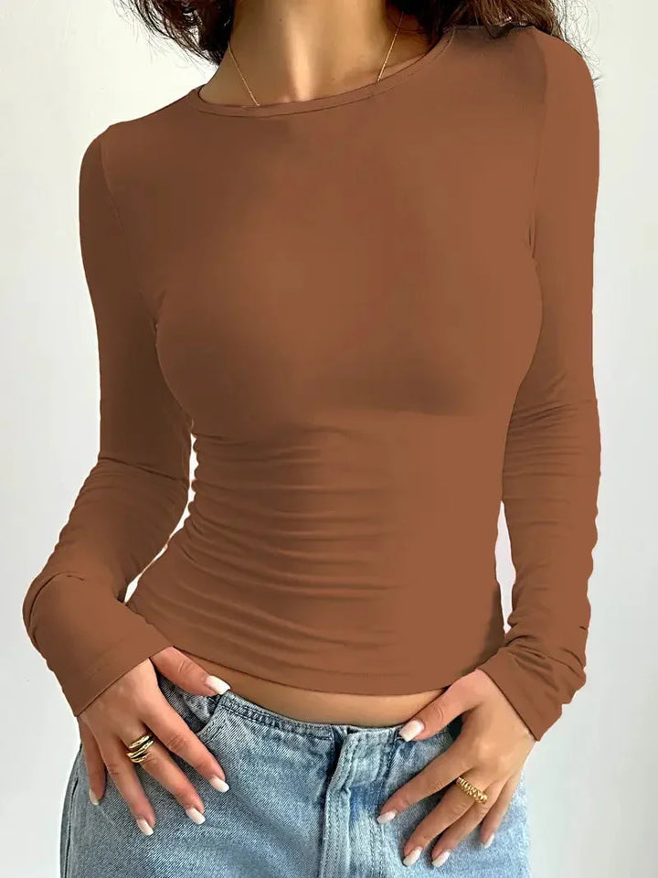 Slim fit long sleeve crew neck top for women with stylish ruched detailing. Great for fashion.