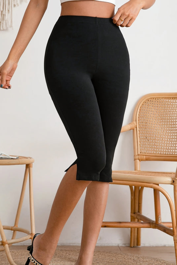 Versatile black slim-fit stretch cropped pants for women, offering chic style and summer comfort.