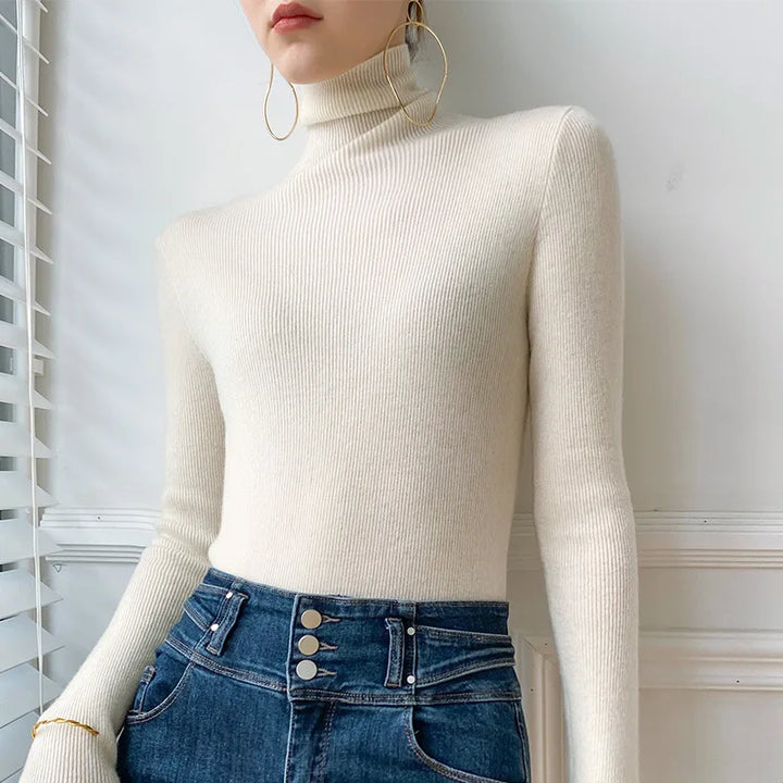 Soft, slim fit women's turtleneck sweater, an elegant long sleeve layering top for winter.