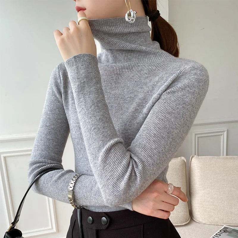 Women's elegant turtleneck sweater, a slim fit layering top for comfortable winter fashion.