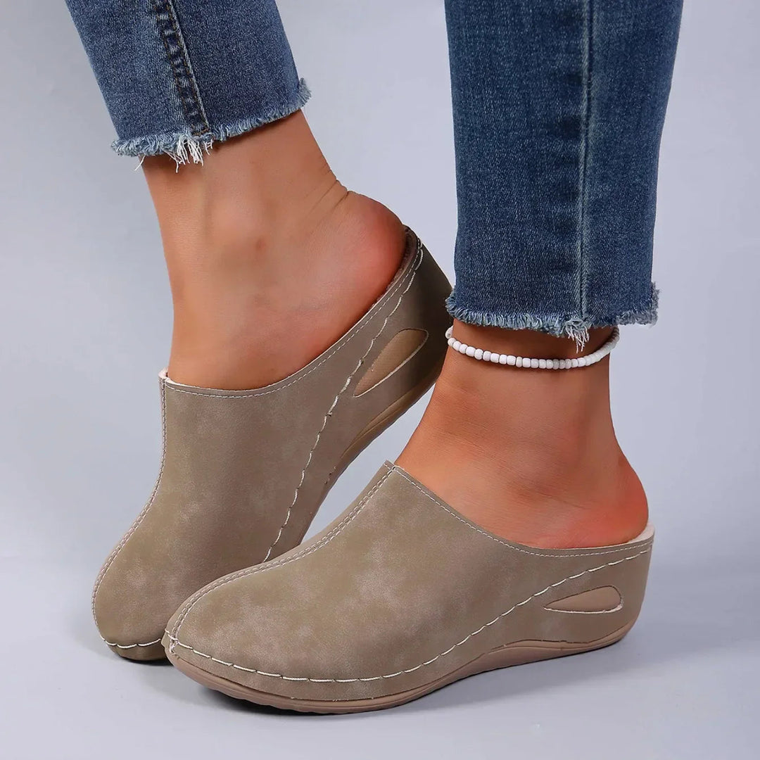 Women's comfort clogs with a slip-on design, providing cushioned support & lightweight feel for easy, everyday wear.