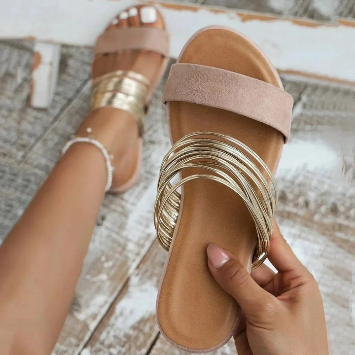 Fashionable flat beach sandals for women, perfect for vacation & summer comfort.