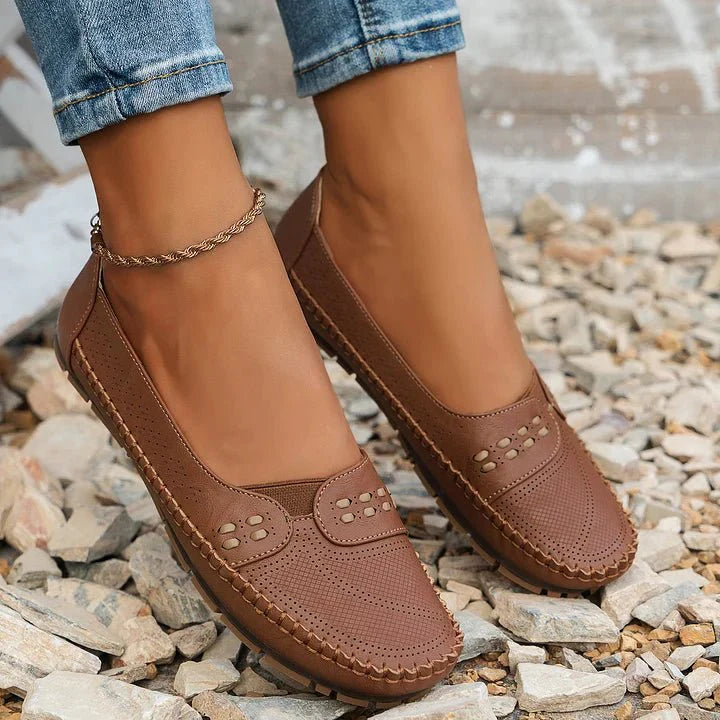 Comfortable women's slip-on loafers with perforated design, ideal for spring & summer casual walking.