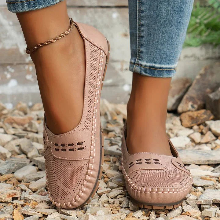 Breathable women's walking loafers, comfortable slip-on shoes with perforated design for everyday wear.