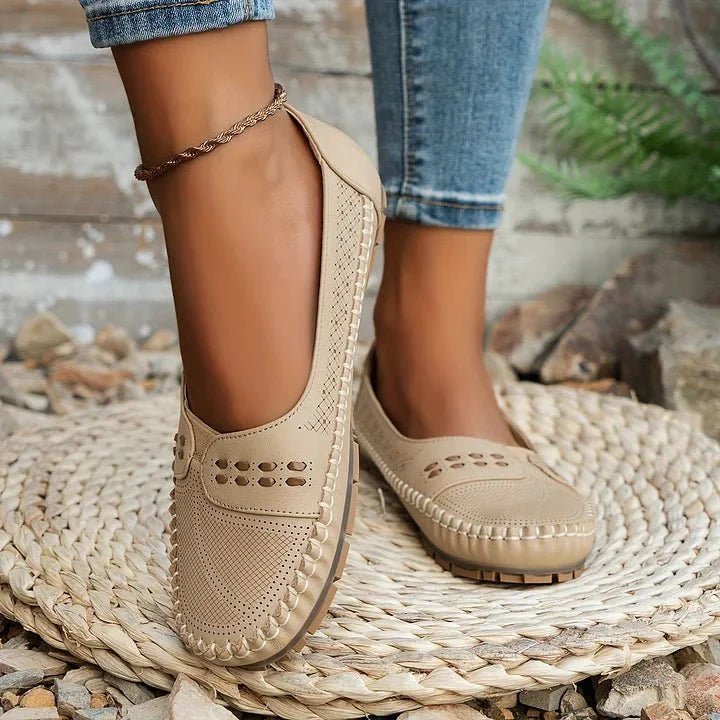 Women's comfortable slip-on loafers. Everyday breathable flats with perforated design for casual style.
