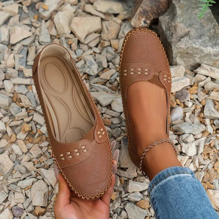 Casual women's slip-on loafers, comfortable everyday footwear with a breathable perforated design.