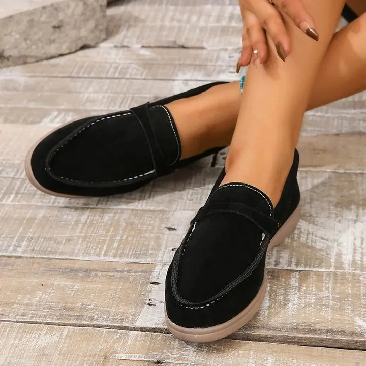 Women's flat slip-on loafers, soft cushioned insole for office & casual versatility.