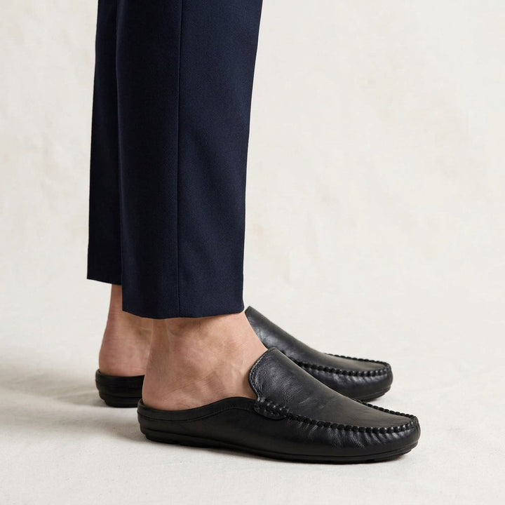 Stylish women's open-back mules with hand-stitched detail. Comfortable slip-on flat casual footwear for elegance.