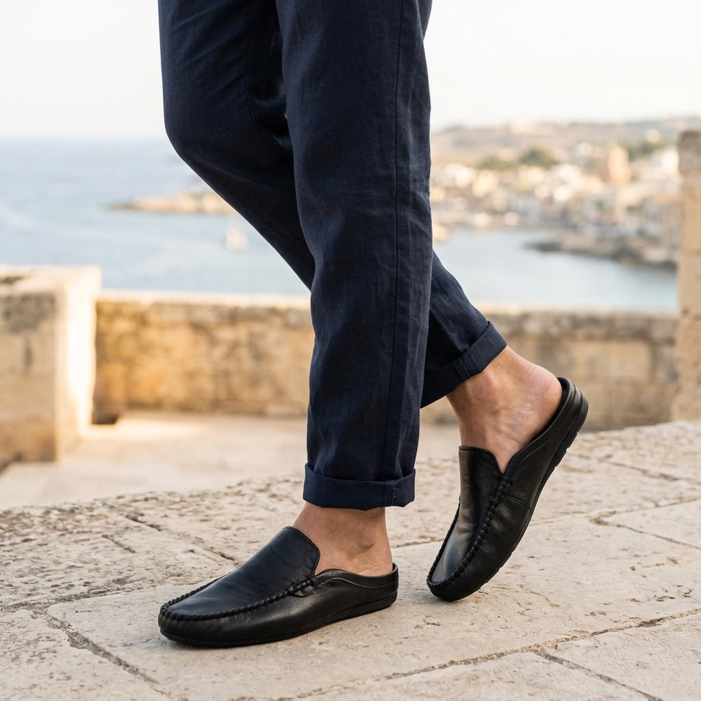 Elegant women's slip-on mules, hand-stitched for comfort & style. Flat casual shoes, perfect for warm weather.