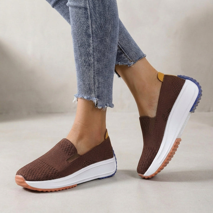 Women's orthopedic slip-on platform sneakers providing arch support & comfort for walking & active wear.