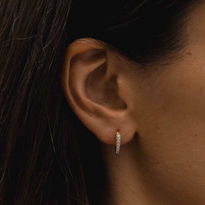 Sparkling zirconia small hoop earrings for women. Adds a subtle shine to any outfit, hypoallergenic.