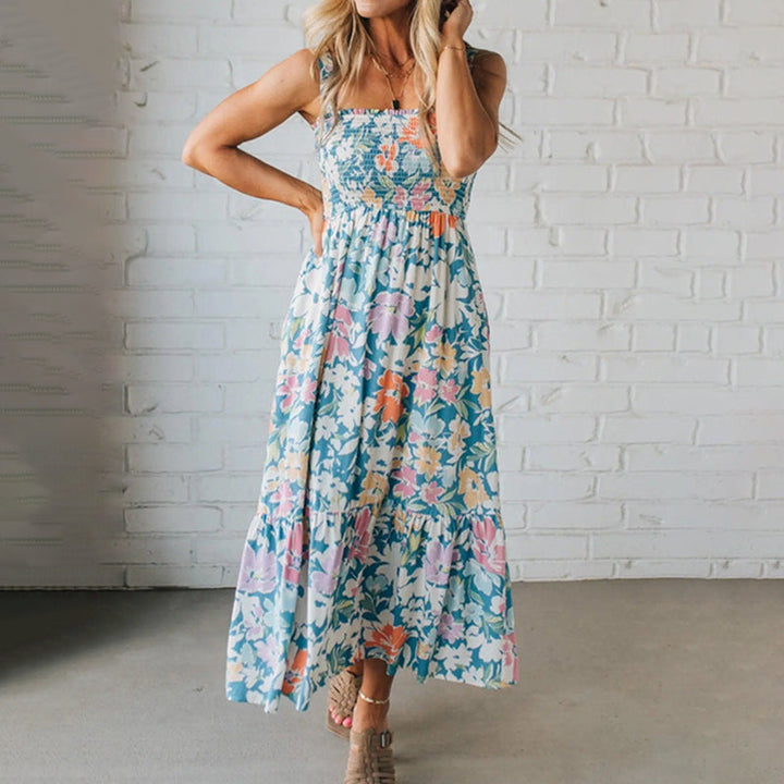 Women's smocked floral maxi dress with ruffle hem, perfect for summer.