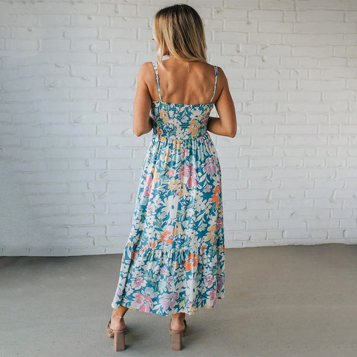 Elegant women's sleeveless floral maxi dress with smocked bodice, perfect for summer.