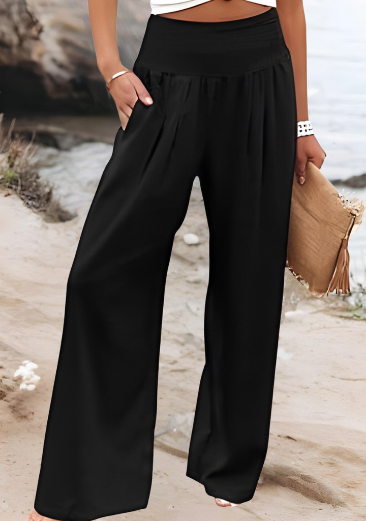 Comfortable women's wide leg pants with smocked high waist. Perfect for summer, vacation, or relaxed everyday wear.
