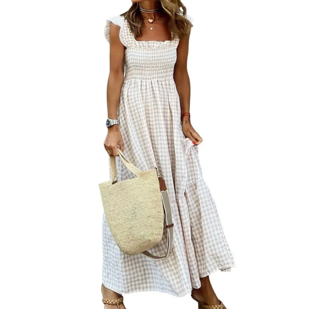 Women's smocked tiered maxi dress for effortless summer style, vacation, and spring fashion.