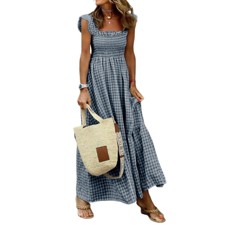 Flowy smocked maxi dress for women. Comfortable tiered design, ideal for casual everyday wear or vacation.