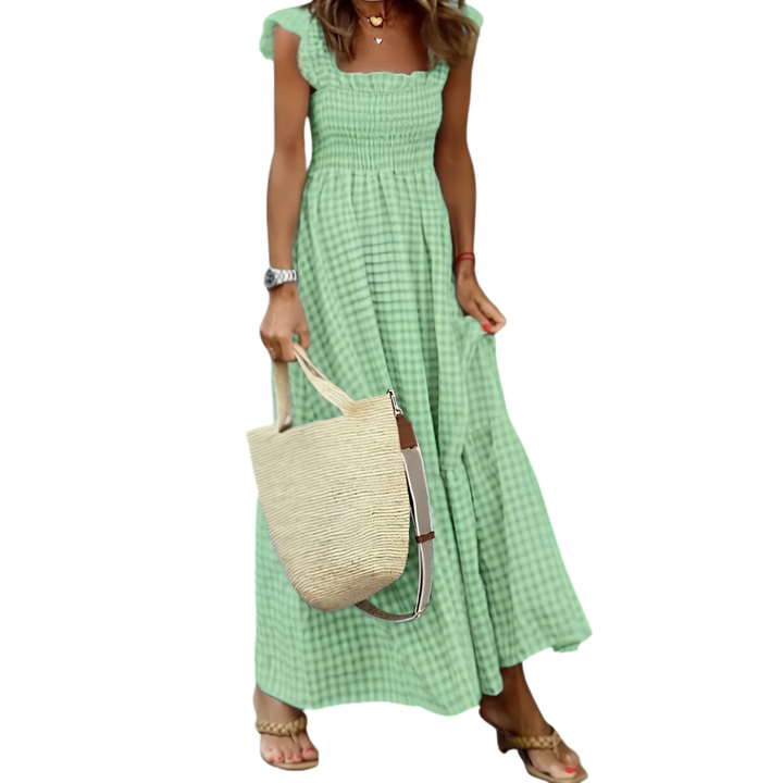 Comfortable women's smocked tiered maxi dress. Versatile for everyday style, vacation, or summer fashion.