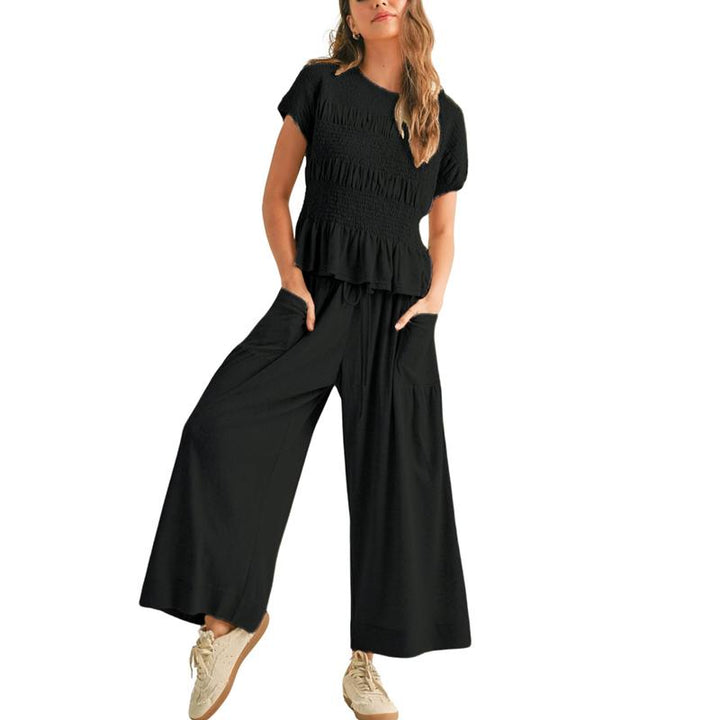 Women's smocked wide leg lounge set in cotton blend, perfect for comfortable and elegant casual chic.