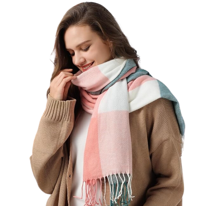 Women's oversized cashmere blend plaid scarf, worn as a shawl, providing warmth and style during winter.