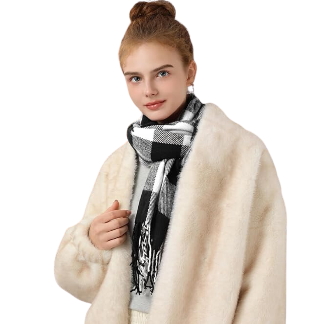 Stylishly bundled women's cashmere blend plaid scarf, classic black and white checks, perfect for winter.