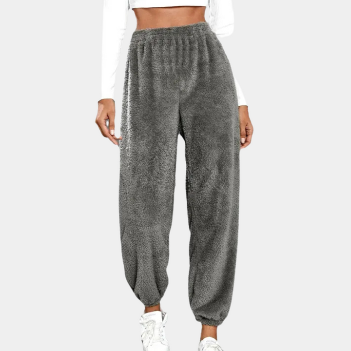 Soft women's relaxed lounge pants for ultimate comfort. Stylish elastic waist design, perfect for cozy casual fashion.