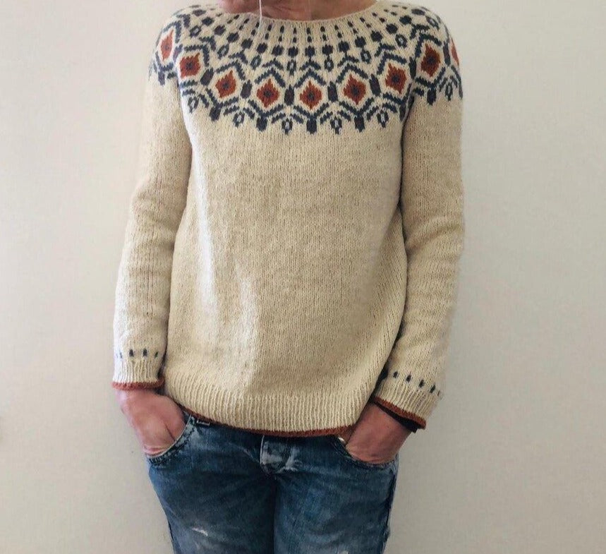 Warm & elegant knitted sweater for women, ideal for autumn style, offering cozy winter comfort.