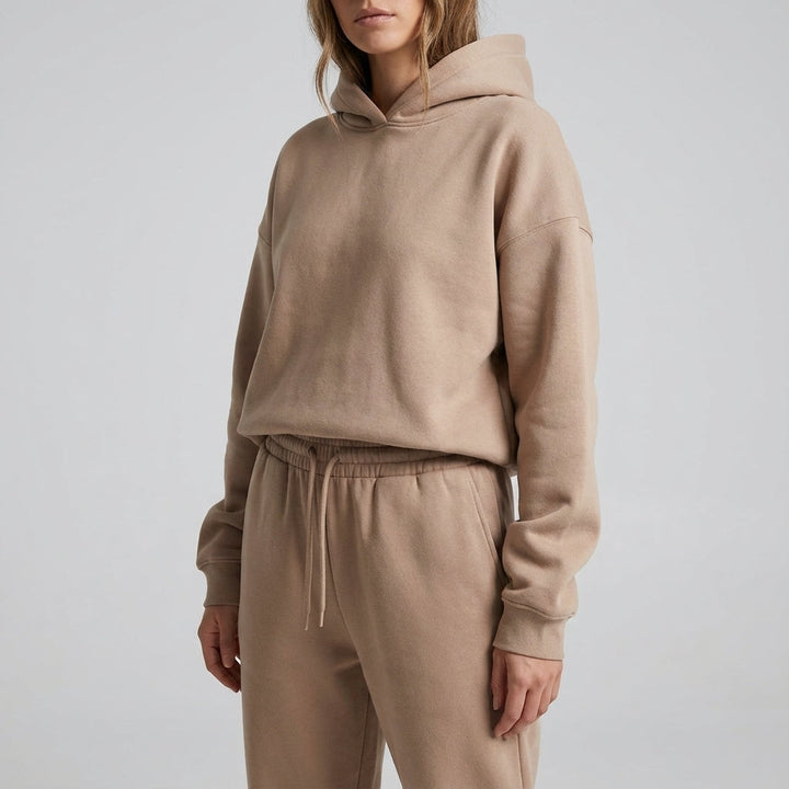 Sporty two-piece tracksuit for women made from a soft fabric mix, ideal for casual wear.