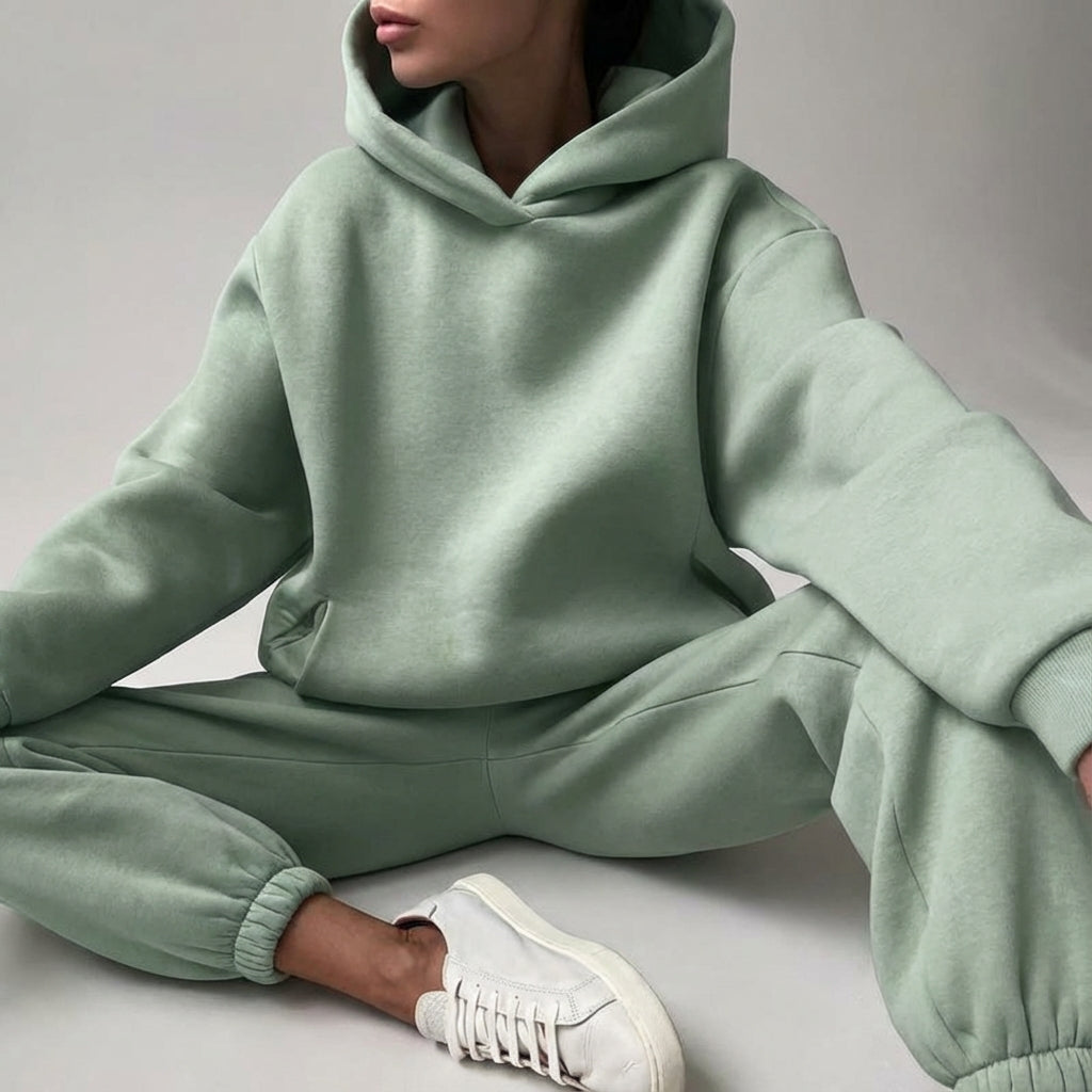Oversized soft fabric women's tracksuit, a sporty two-piece for all-season comfort.