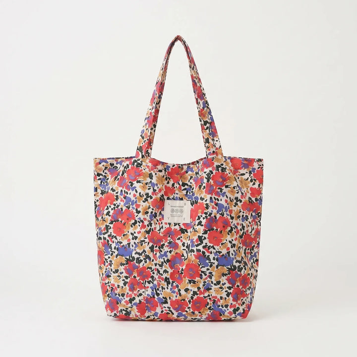 Comfortable shoulder tote bag with a vibrant floral print for women, spacious and soft.