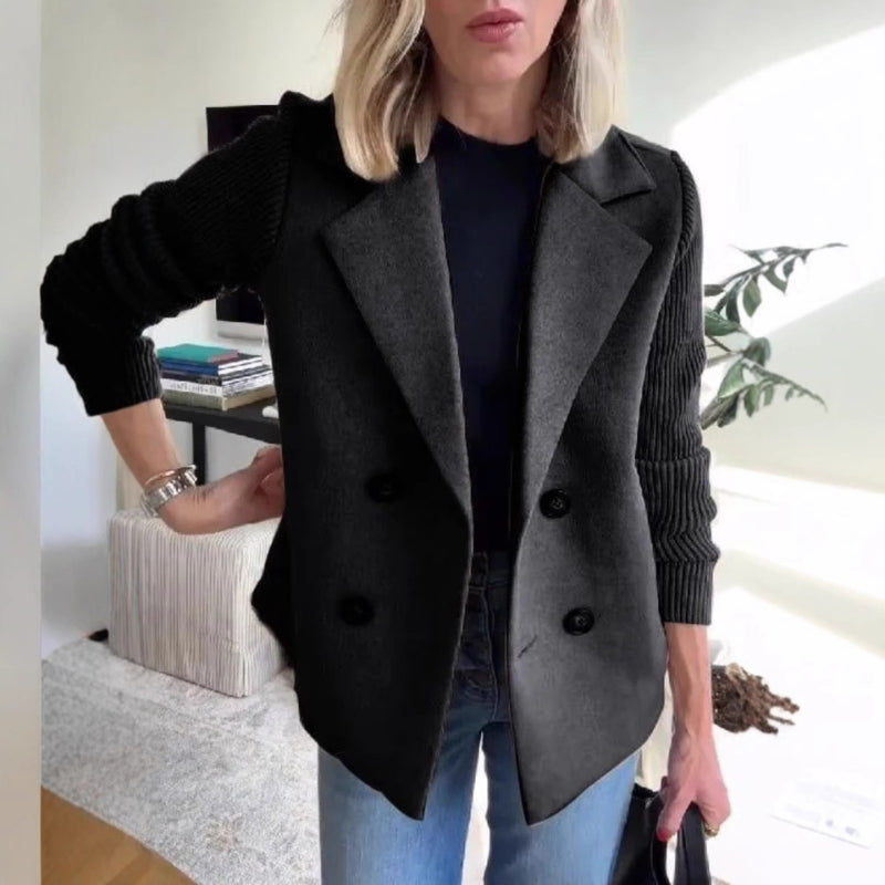 Woman wearing a sophisticated gray soft knit sweater blazer, showcasing its comfortable tailored fit.