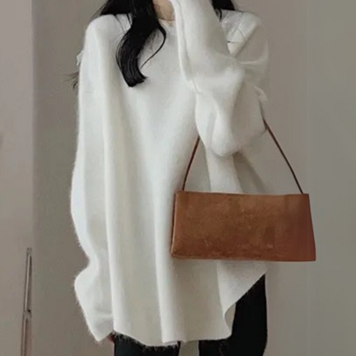 Warm women's knitted sweater, a cozy and stylish pullover designed for ultimate comfort.