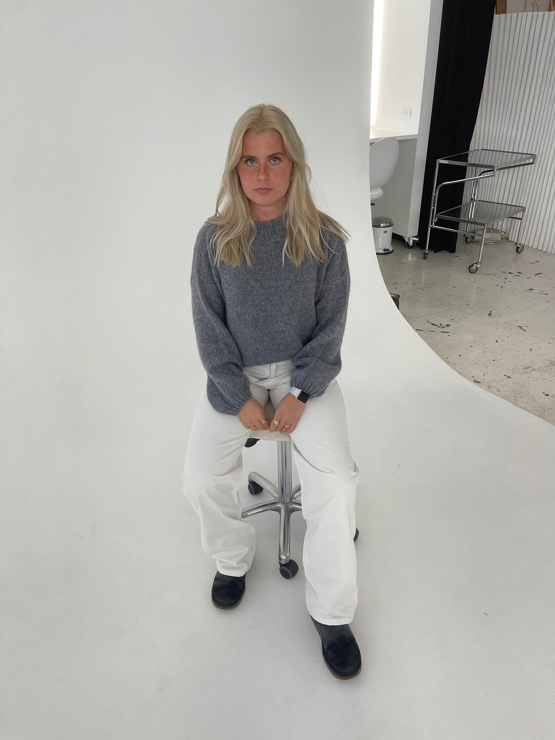 Women's soft knit loose fit pullover, designed for cozy winter warmth.