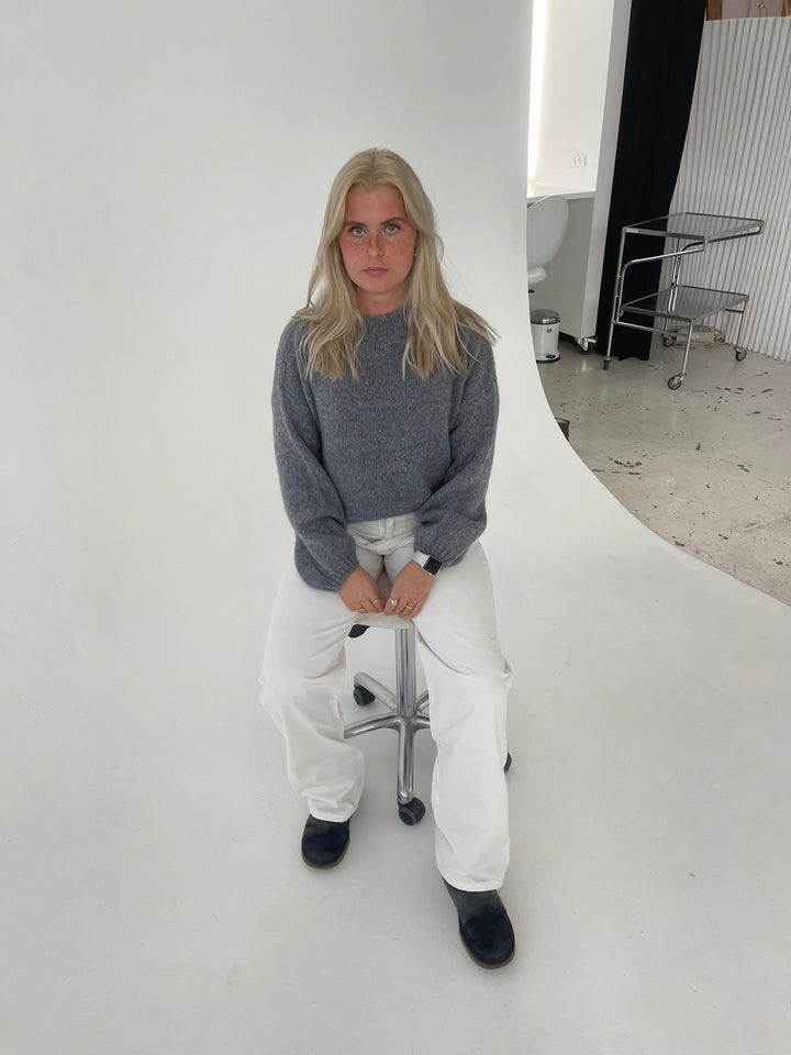 Women's soft knit loose fit pullover, designed for cozy winter warmth.