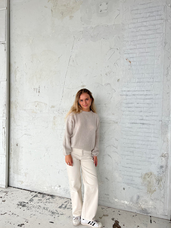 Soft knit women's top, loose fit, round neck, ideal for seasonal apparel.