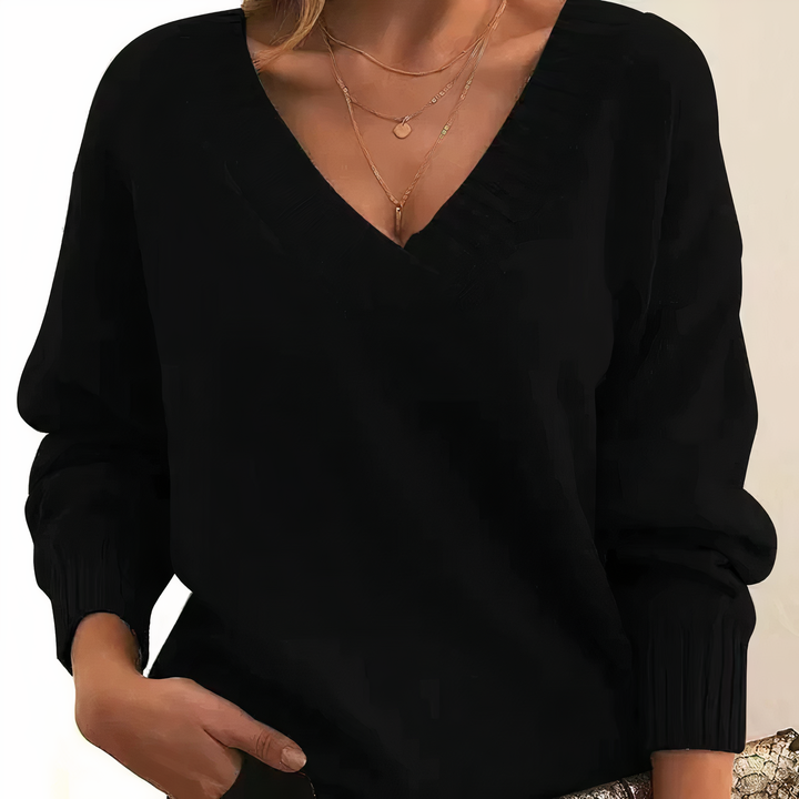 Women's soft V-neck knit sweater in a cozy, comfortable fit, perfect for everyday wear.