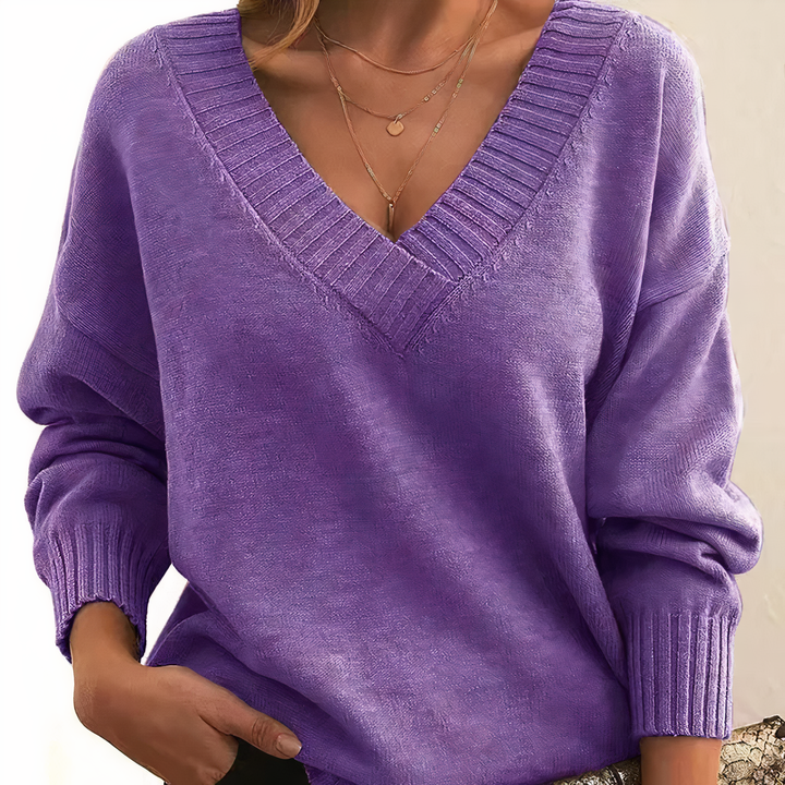 Plush women's V-neck sweater, a soft and comfortable knit top with a relaxed fit for casual elegance.