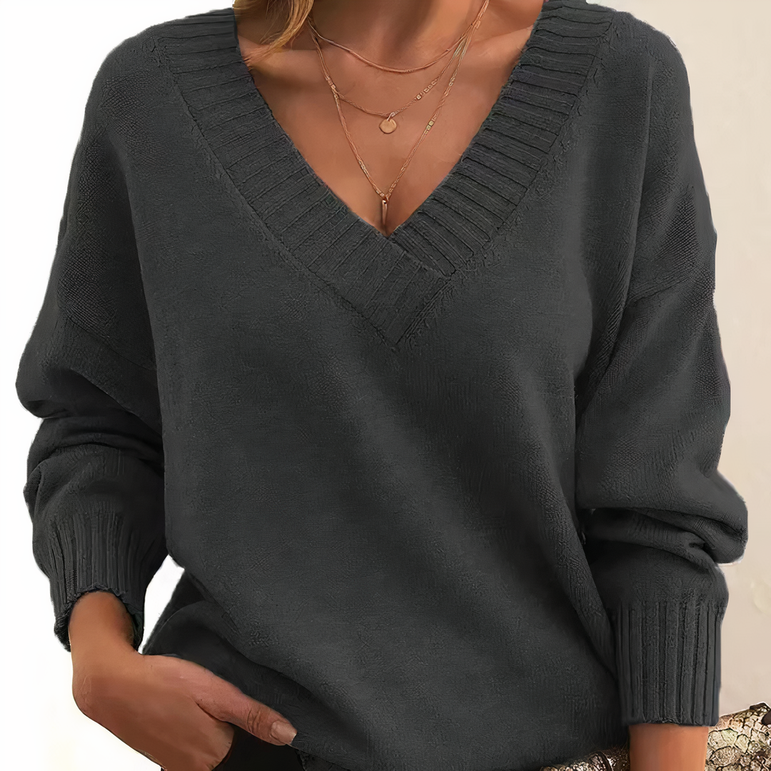 Stylish women's V-neck sweater, a warm and elegant knit top for versatile fall and winter outfits.