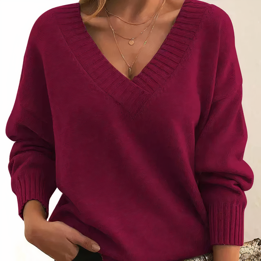 Soft V-neck women's sweater, a comfortable knit top with a cozy fit, essential for fall fashion.