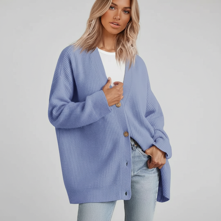 Winter fashion essential: a women's long sleeve V-neck cashmere sweater, relaxed fit.