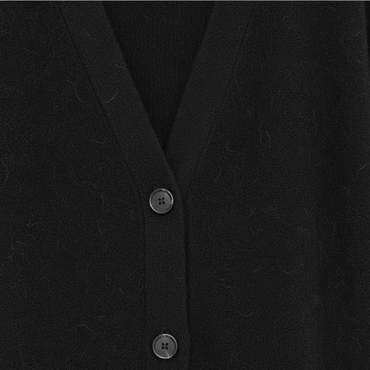 Elegant women's V-neck cashmere sweater, ideal for cozy winter outfits and casual wear.