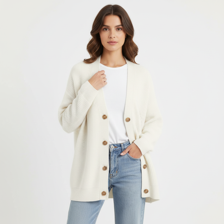Woman wearing a relaxed fit V-neck cashmere sweater, showcasing its comfort and style.