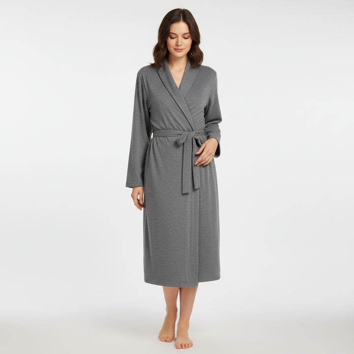 Elegant women's white cotton bathrobe, ideal for lounging, featuring a cozy terry cloth texture