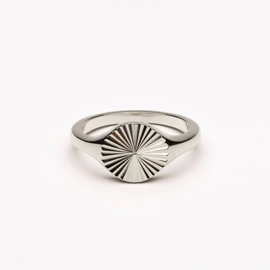 Chic women's Solara Sun Signet Ring, combining gold and silver metals with a radiant sun.