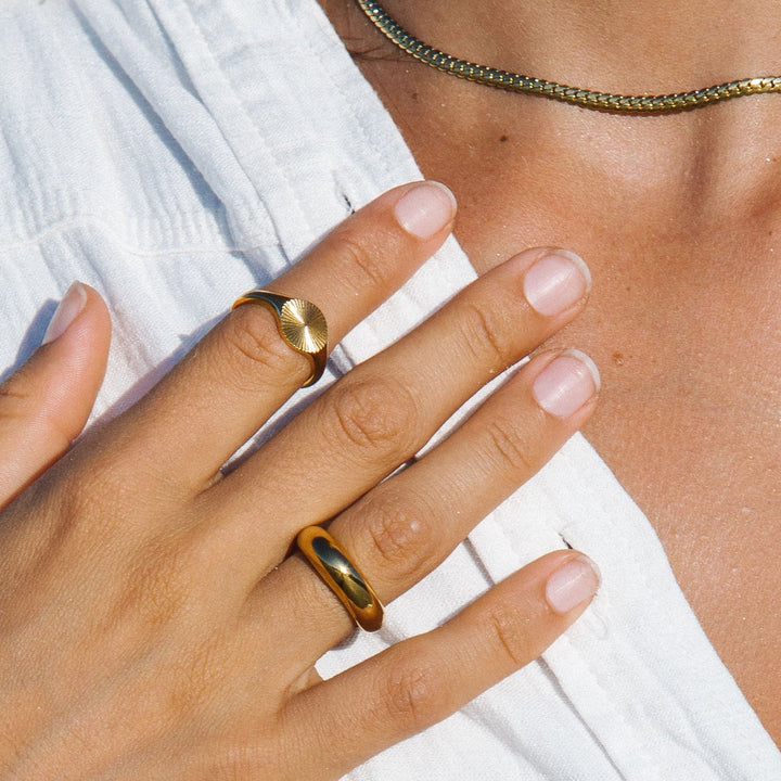 Hypoallergenic women's Solara Sun Signet Ring, stunning gold and silver sun design for sensitive skin.