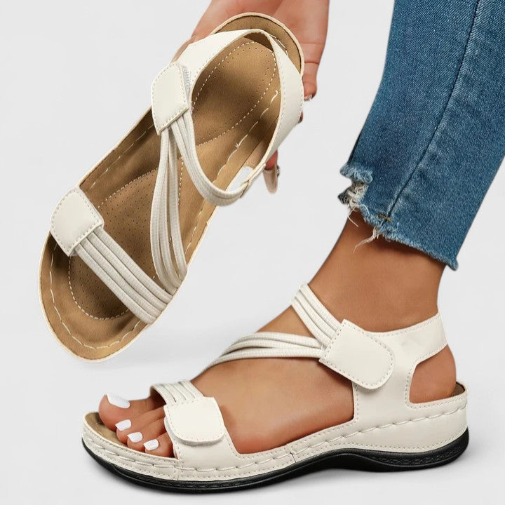 Stylish women's slip-on sandals with advanced arch support for ultimate comfort.